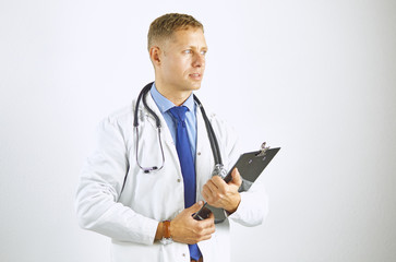 Young confident doctor in a white coat with a stethoscope