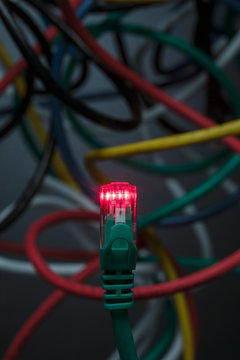 Red Light Emitting From Green Computer Cable