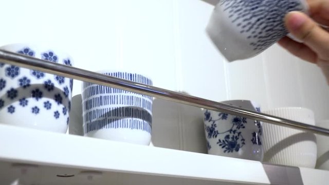 Hanging tea cup on the wall.