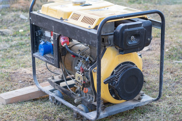 close-up. Street lighting. A gasoline-powered generator that produces current. Backup or emergency...