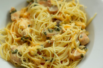 Cooked chicken breast with vegetables and mushrooms in a creamy sauce with pasta