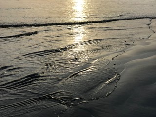 Waves on the beach during sunset