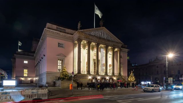 Illuminated Berlin State Opera House building at night. Time lapse video.