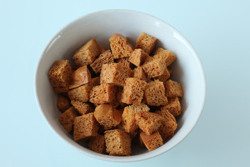 white bowl with brown wheat breadcrumbs objects