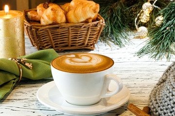 cup of coffee and cookies on wooden table