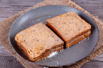Preparing toast with cheese