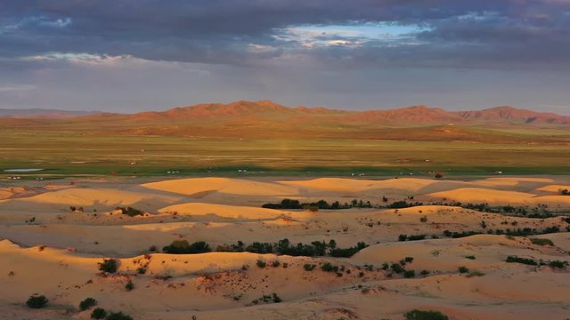 Aerial view of the sand dunes Elsen Tasarhai (Bayan Gobi) at sunrise in Mongolia, 4k