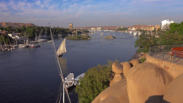 Beautiful landscape with felucca boats on Nile river in Aswan at sunset, Egypt, 4k