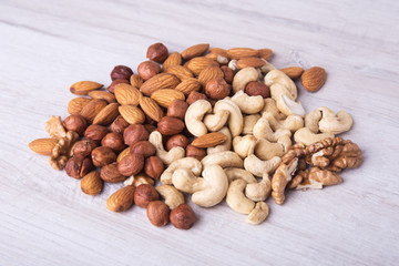Assortment nuts on wooden table. Close up.