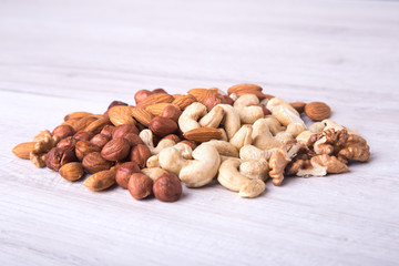 Assortment nuts on wooden table. Close up.