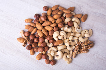 Assortment nuts on wooden table. Close up.