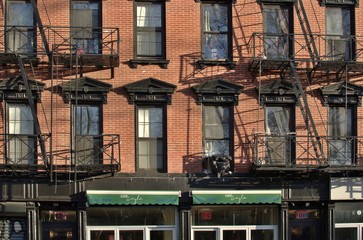 Downtown Manhattan Tenement Buildings with New Trendy Café Shop Developments Gentrification