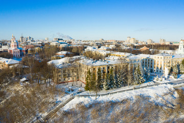 Fototapeta na wymiar Kirov and the high bank of the river Vyatka and the Alexander Grin Embankment and Trifonov Monastery on a sunny winter day