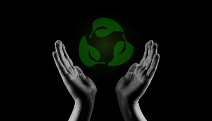 Helping the environment hands. Caring about Sustainability Concept. Mans hands palms up recycling icon.