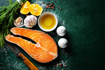 Raw fish steaks with ingredients