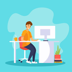 Young man freelancer working on computer at home or in the office. Guy sitting at the desk and looking at the screen. 