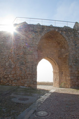 Obraz premium Street with a wall gate a foggy morning