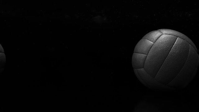 3d design of retro volleyball balls on the dark background. Looped animation of rolling old style volley balls from leather on the universe and stars background.