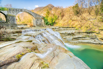Brusia waterfalls and Bridge in mountains of Forl&igrave;