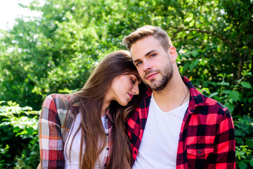 Fototapeta premium Cute couple. valentines day. summer camping in forest. family weekend. romantic date. hipster couple outdoor. couple in love. Hiking. man and woman in checkered shirt relax in park
