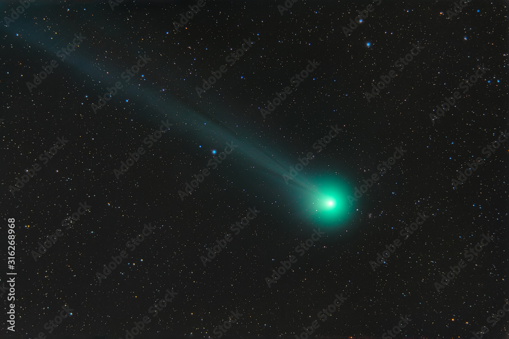 Wall mural photo of a real comet. comet c 2014 q2 loveioy. outer space with a flying comet.