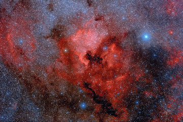 Abstract background with space image. Cosmic nebula, stars glow in red in space. Long exposure photo. Photo of real space through a telescope.
