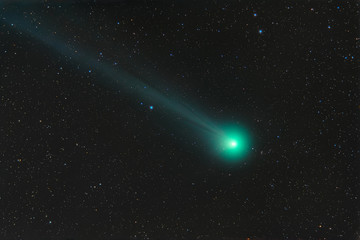 Obraz na płótnie Canvas Photo of a real comet. Comet C 2014 Q2 LOVEIOY. Outer space with a flying comet.