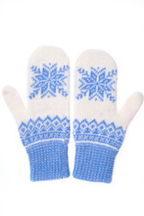 Warm woolen knitted mittens isolated on white background. Blue knitted mittens with pattern