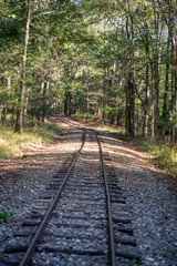 Obraz premium Railroads and roadways make there way through Broken Bow, Oklahoma.