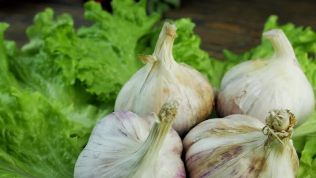 Lettuce and garlic on a rotating background