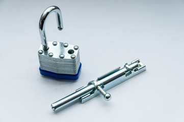 Close-up small padlock and latch for a door