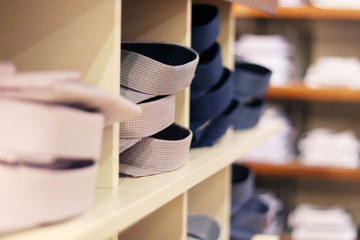 Men's clothing in the store. Men's fashion. Classic shirts on the shelves