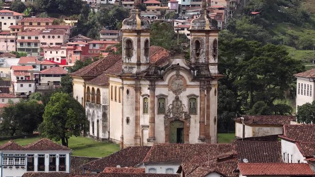 Motion time lapse showing the San Francisco de Assissi church in the city centre of the Brazilian colonial and mining city of Ouro Preto in the state Minas Gerais with clouds passing shadows by