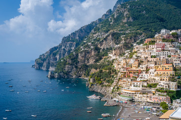 Positano town and sea bay with boats moored. Amalfi coast, Italy.