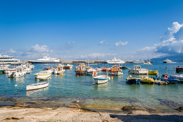 Naklejka na ściany i meble Fishing boats at Capri marina. Capri island, popular Italian travel destination.