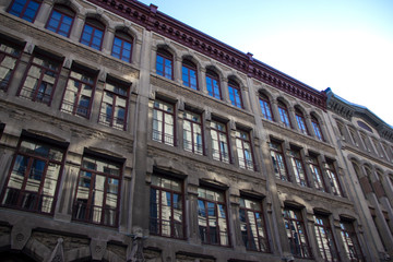Reflections in the windows of a historic building