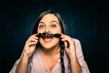 Young Woman Making a Mustache with her Braid