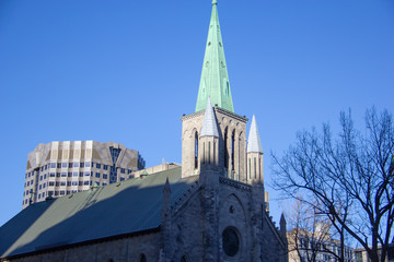 Fototapeta na wymiar Blue sky and a green church spire