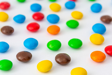 Abstract background. chocolate dragees in colored glaze.