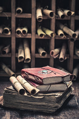 Magic books and scrolls in antique library