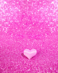 Obraz premium pink heart on a blurry, not sharp pink background with bokeh. Place for text. Valentine's Day