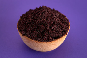 Bowl Full of Organic Acai Powder a Superfood on a Bright Purple Background