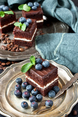 Mini  chocolate cakes  with mint and blueberry