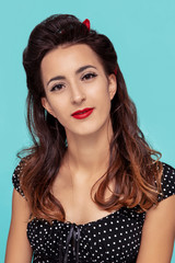 Portrait of young woman in pin-up style