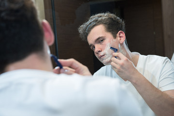 young man shaving