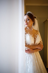 Beautiful bride dresses her white wedding dress