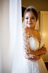 Beautiful bride dresses her white wedding dress
