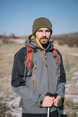 Fototapeta premium Portrait of bearded hiker with hiking equipment