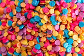 Fototapeta na wymiar Glittery Rainbow Sprinkles for Decorating your Baked Goods