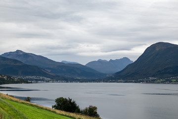Fototapeta na wymiar Cloudy summer day in Norway fjord nature travel 